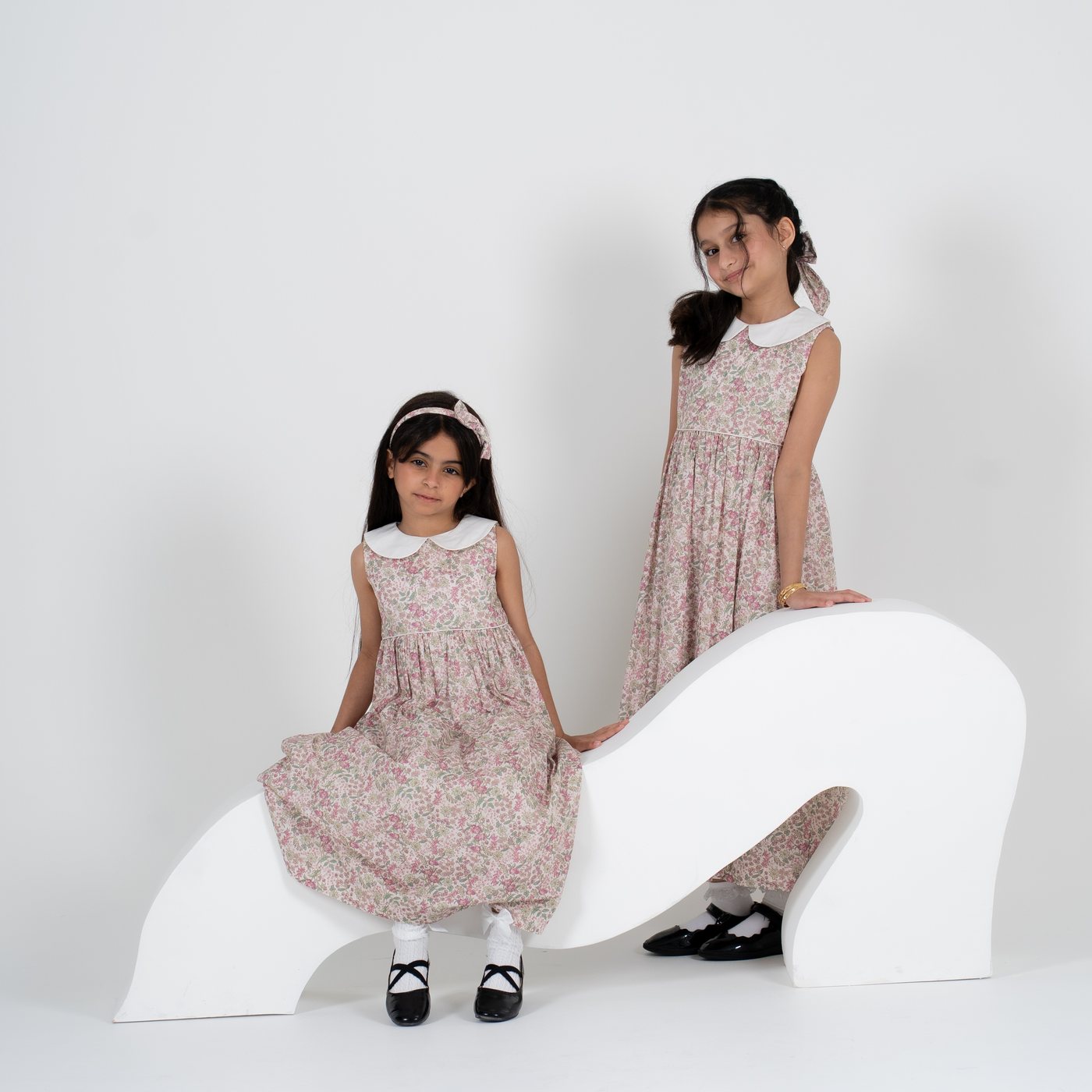 Two girls wearing the Hessa Dress