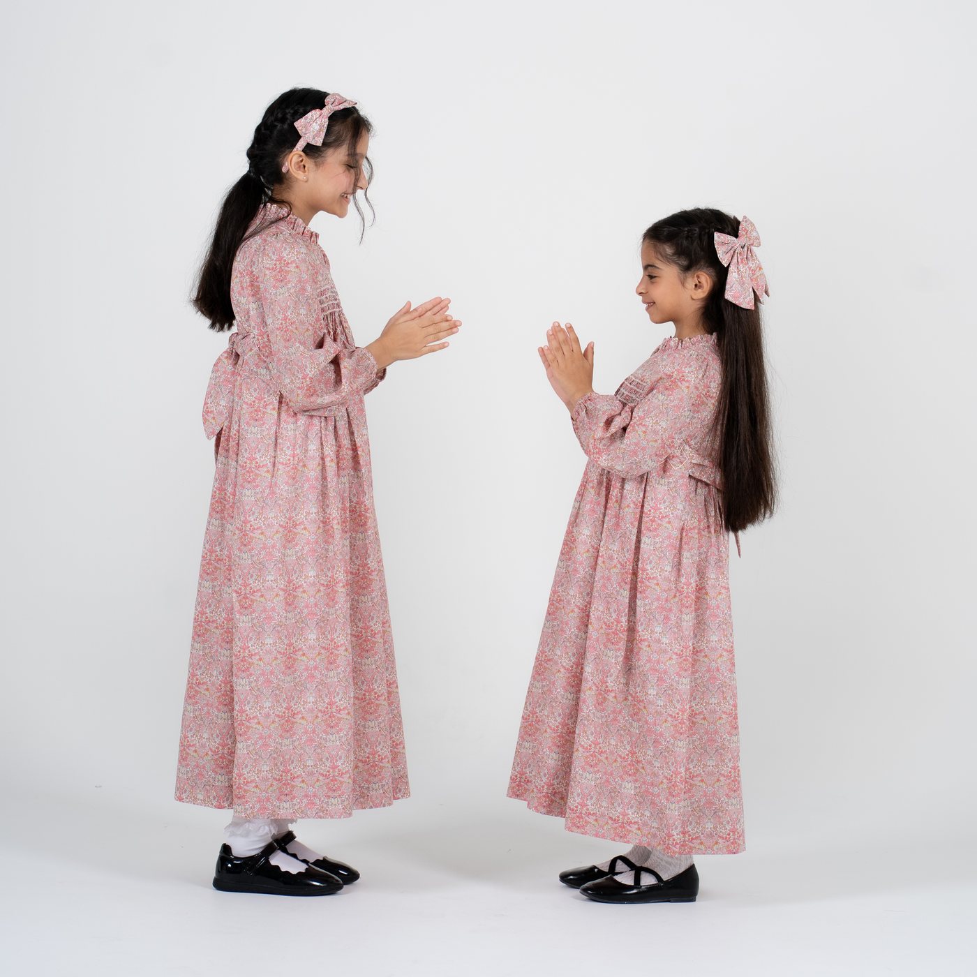 Two girls wearing the Lolwa Dress